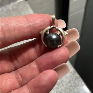 Elegant Silver Dolphin Pendant with Black Hematote Pearl